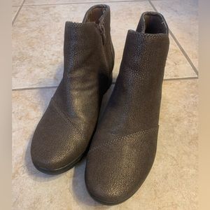 Women’s Clark’s brown and gold booties.  Never worn. New.